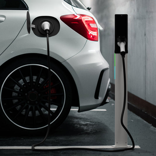 Electric car charging at a charging station in an indoor setting